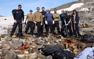 Royal Navy sailors clear waste off Antarctic island