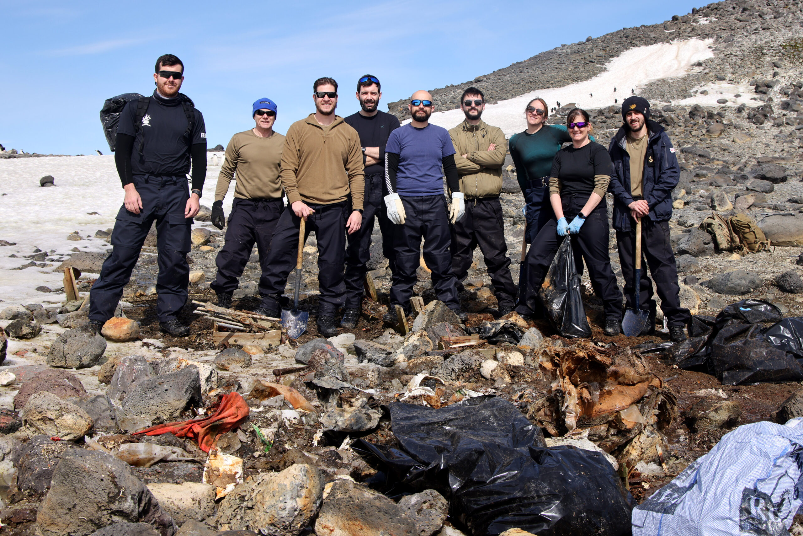Royal Navy sailors clear waste off Antarctic island